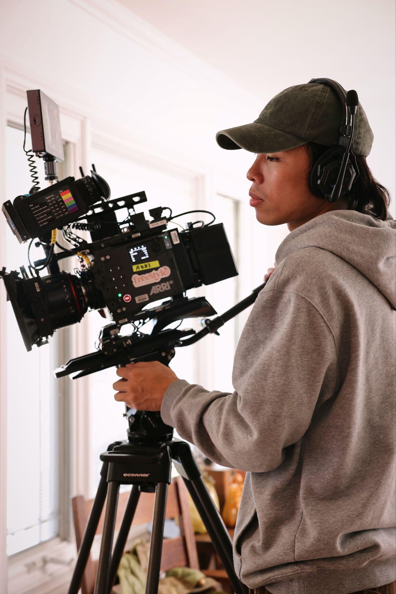 Honglin Zhu operating a cinema camera